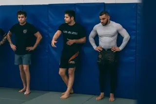 Justin leading a group warm-up, students following in unison