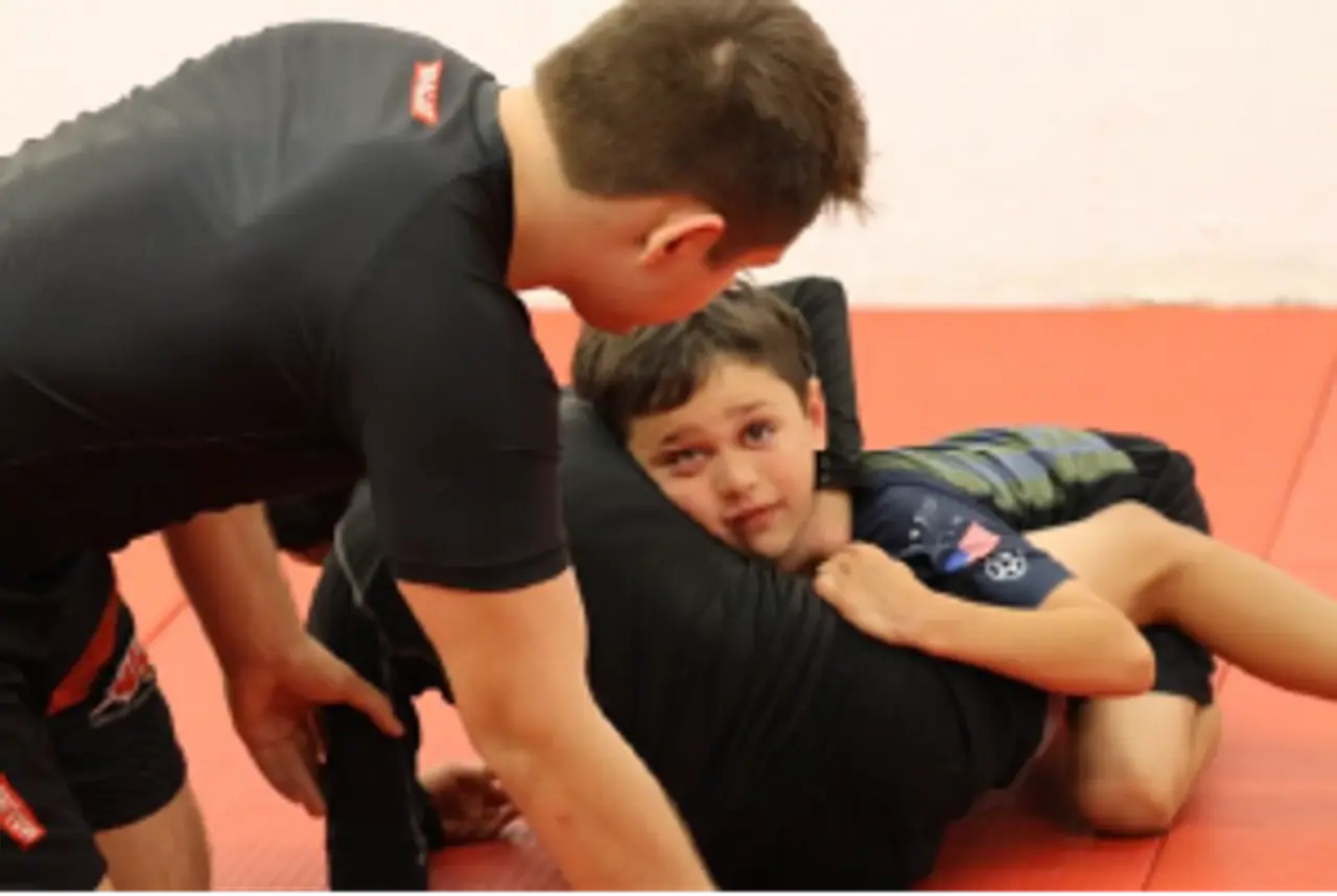 Children training jiu jitsu in the kids program at Alive